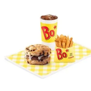 Bojangles Sausage Bo-Berry Biscuit Combo – sweet blueberry biscuit with sausage patty, vanilla icing, side, and drink